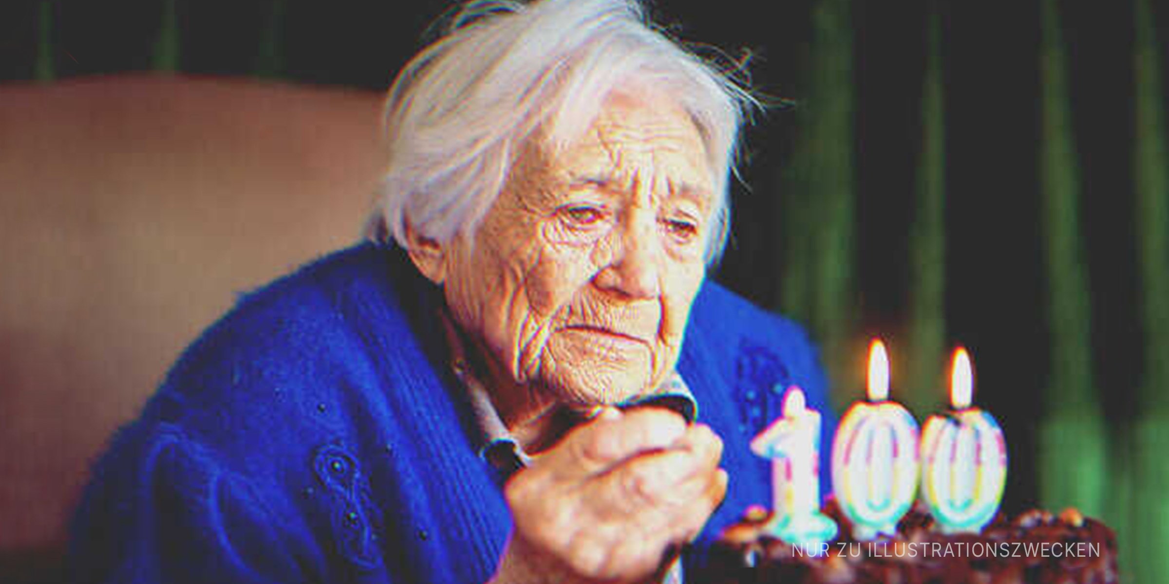 Alte Dame mit ihrer Geburtstagstorte. | Quelle: Getty Images