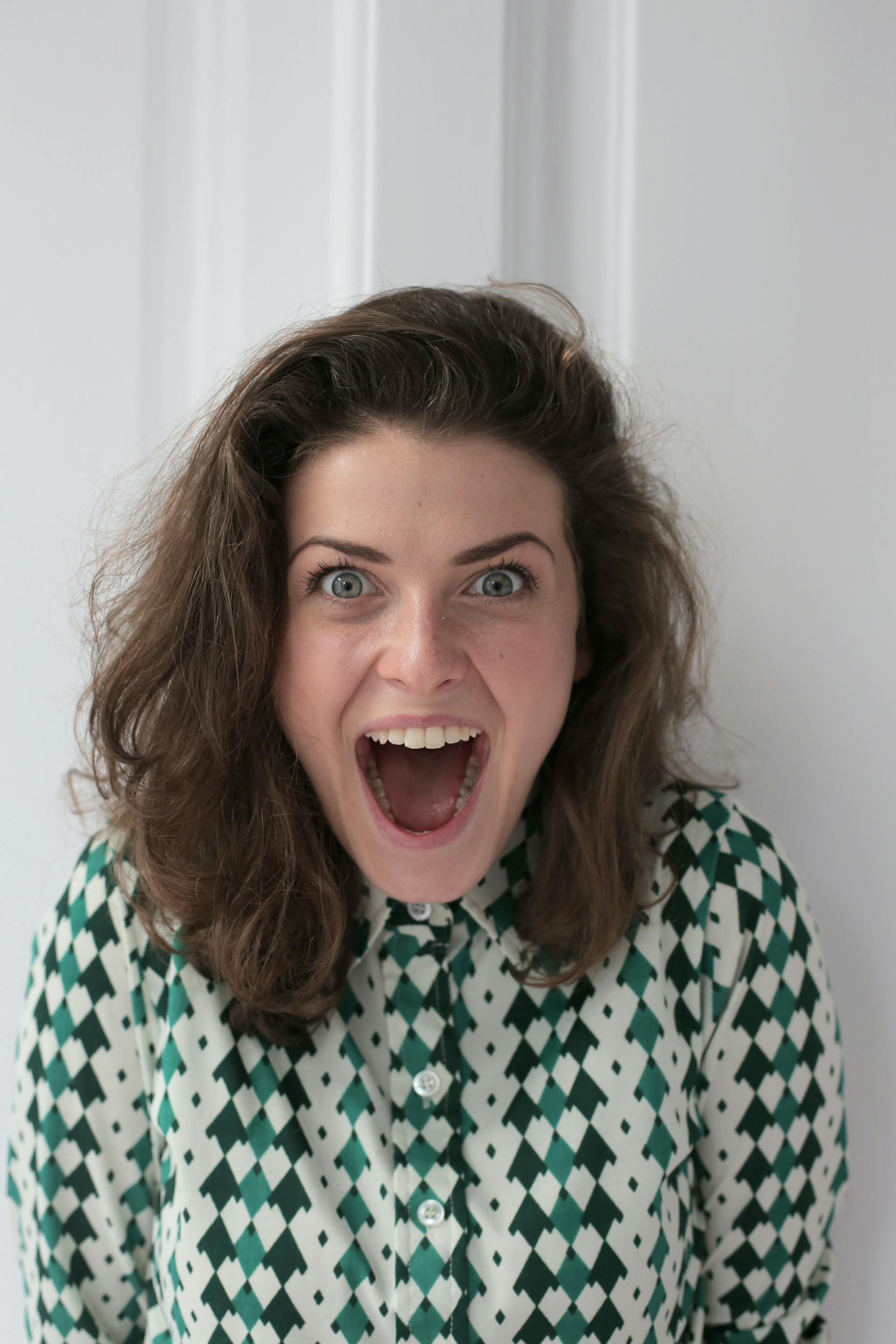 Eine freudig überraschte Frau | Quelle: Pexels