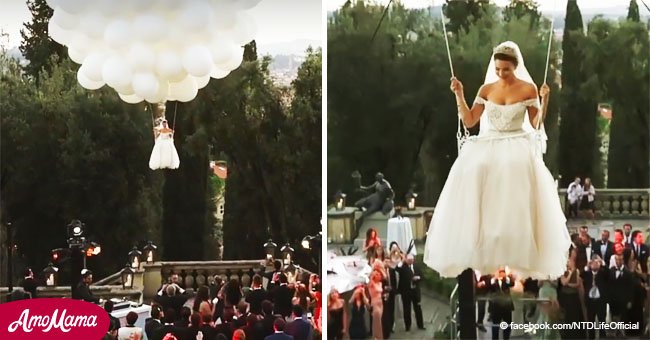 Eine Braut fliegt an dutzenden Ballons auf ihre Hochzeit und die Kamera hält den märchenhaften Moment fest